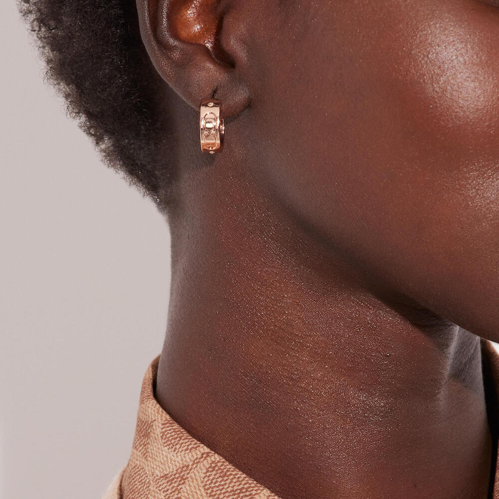 Coach Signature Huggie Earrings in Rose Gold